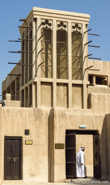 man-in-doorway-and-wind-tower