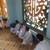 cao dai window and worshipers