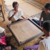 boat-guides-enjoy-board-game-inle-lake
