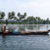 kerala-backwaters-boatman-and-palms