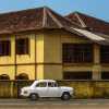 ambassador-and-yellow-building-fort-kochi