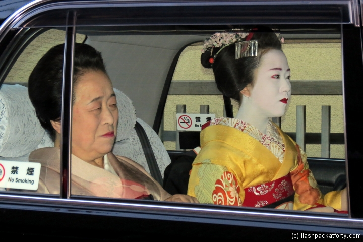 Geisha in taxi Kyoto