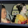 Geisha in taxi Kyoto