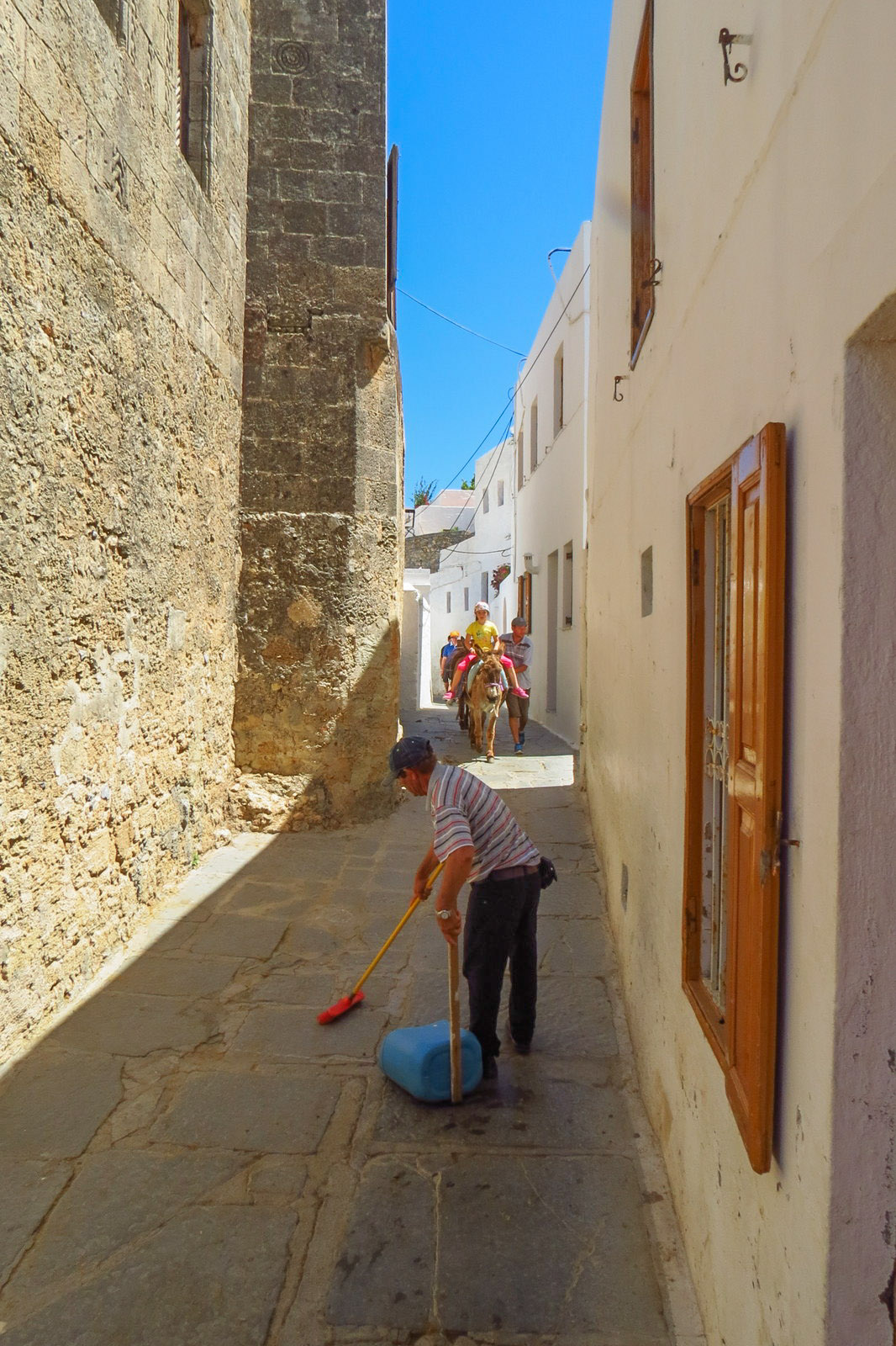 donkey-poo-cleaner-in-lindos-greece