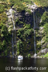 doubtful-sound-falls-small-boat