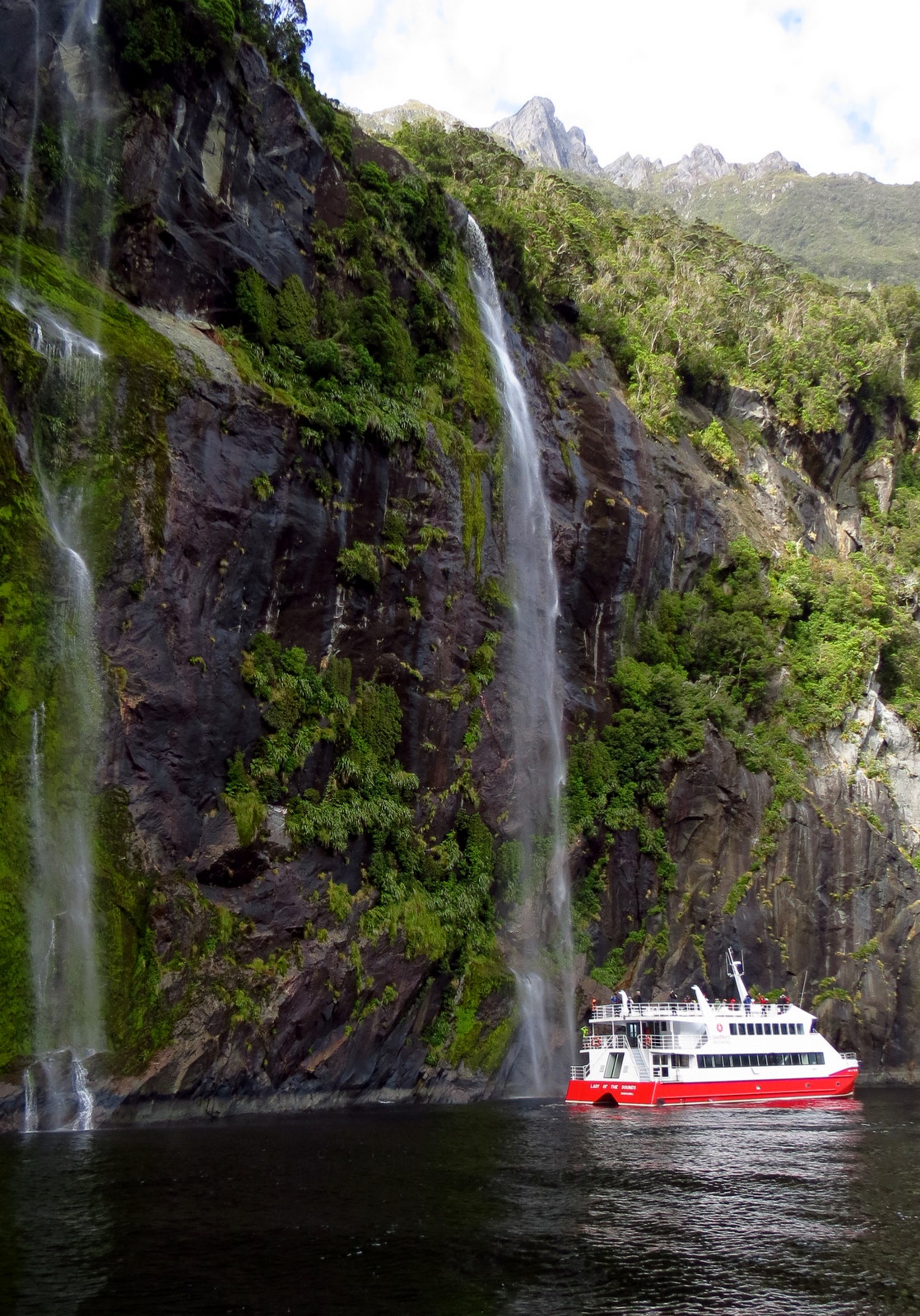 milford-sound-boat-waterfall