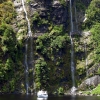 doubtful-sound-falls-small-boat