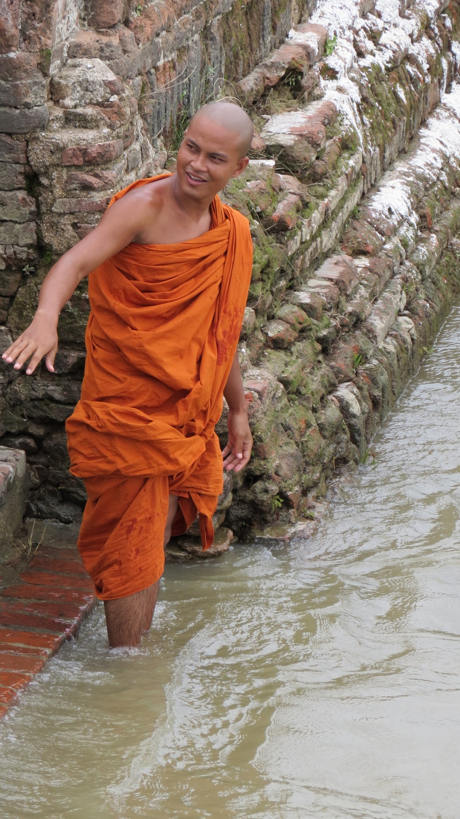 monk bathes at mingun