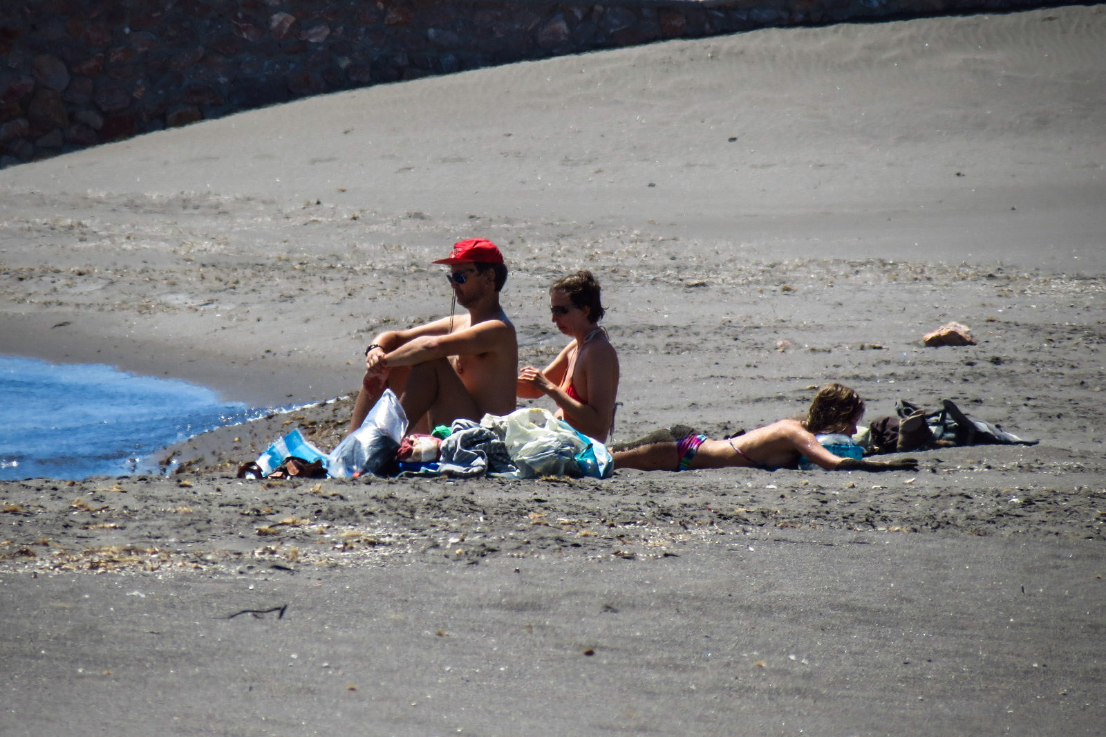 sunbathers-santorini-beaches