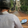 tuk-tuk-driver-approaches-south-gate-angkor-wat