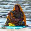 woman-sitting-by-lake-udaipur