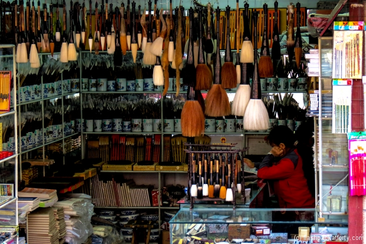 calligraphy-supplies-brushes-and-woman-xian