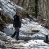 old-man-walking-up-a-snowy-path
